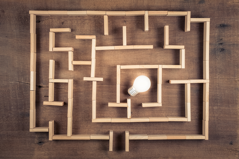 Disability insurance marketing ideas with a maze and lightbulb.